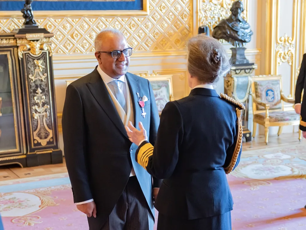 Safaraz Ali MBE speaking with HRH The Princess Royal at his MBE investiture